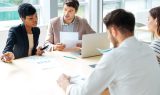 Businesspeople working together on business meeting in conference room