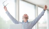 Victorious corporate man celebrating