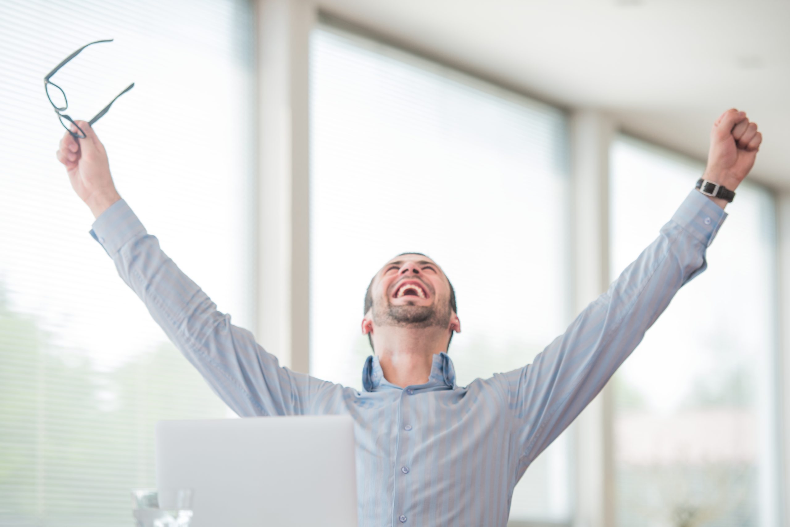 Victorious corporate man celebrating